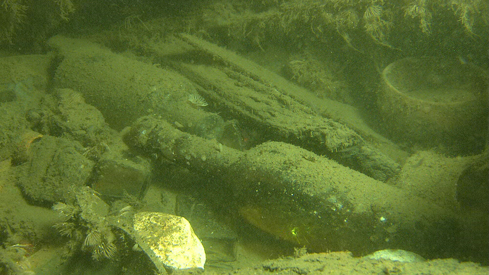 Bottles rest on the seafloor